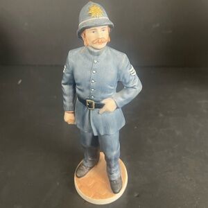 Ceramic Police Officer Figurine in Blue Uniform